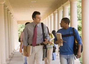 Teacher talking with student outdoors